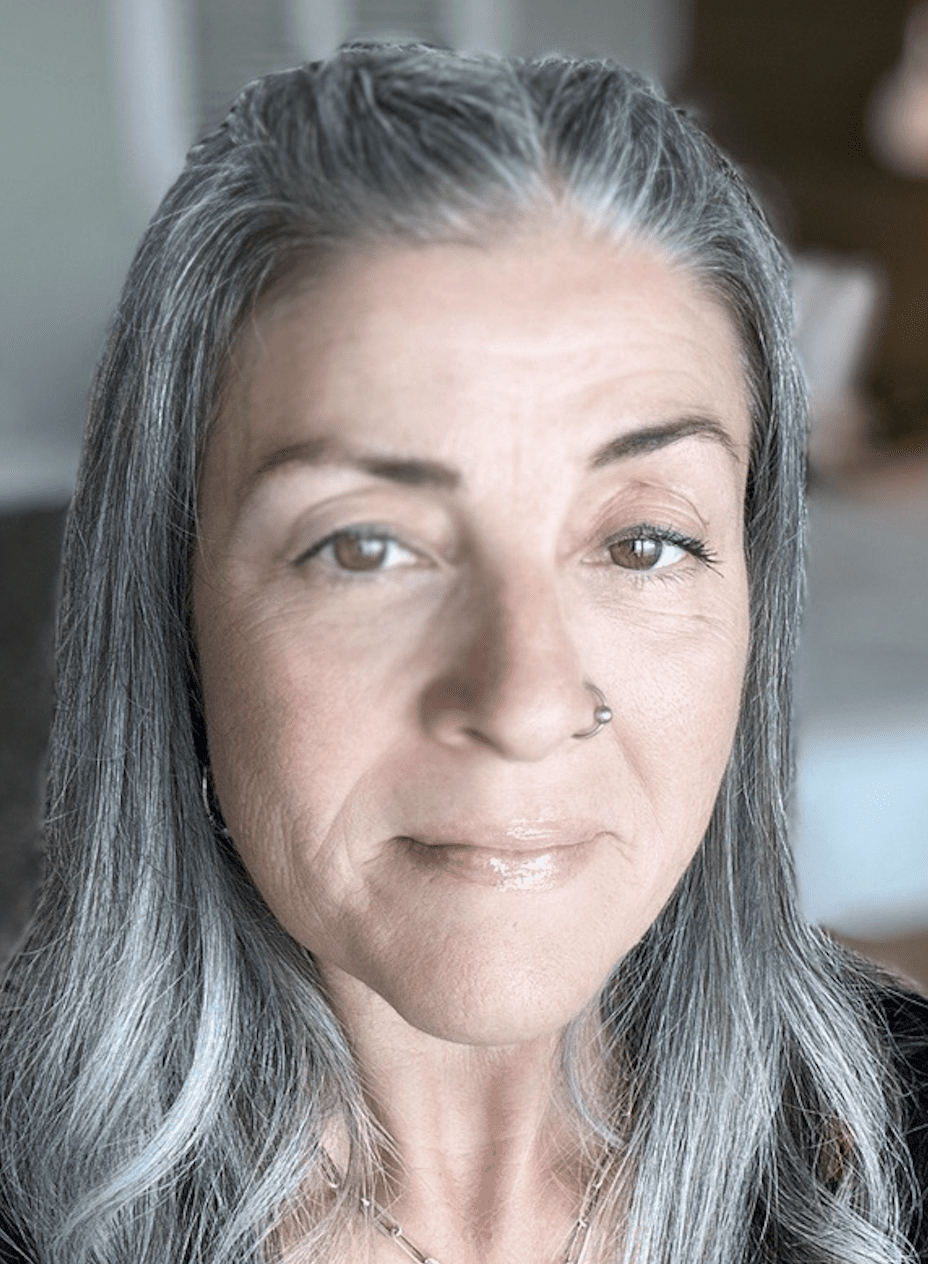 woman with gray hair from intrepid travel adventure travel webinar